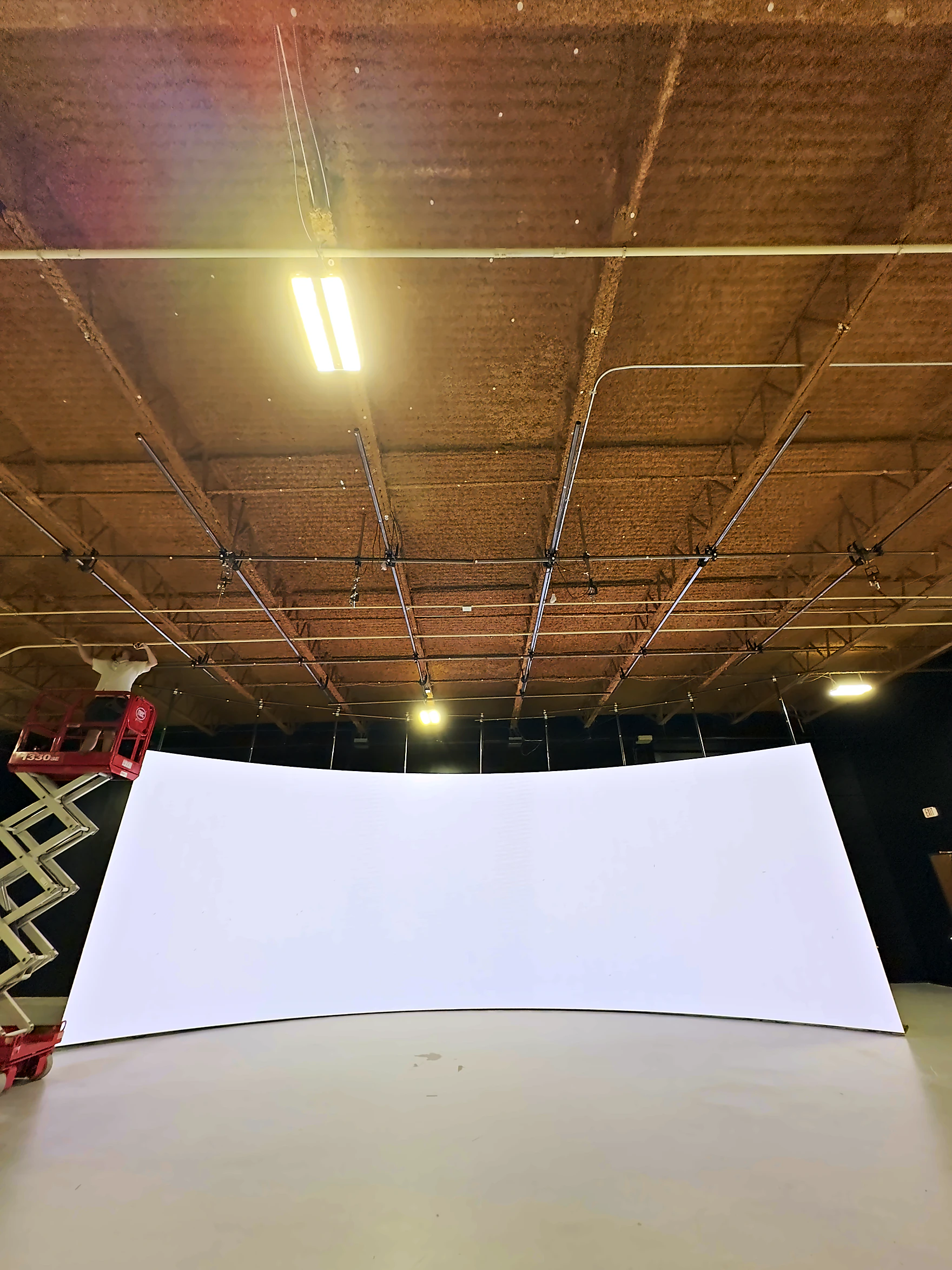 The seamless white curve of the volume, lit flat before calibration