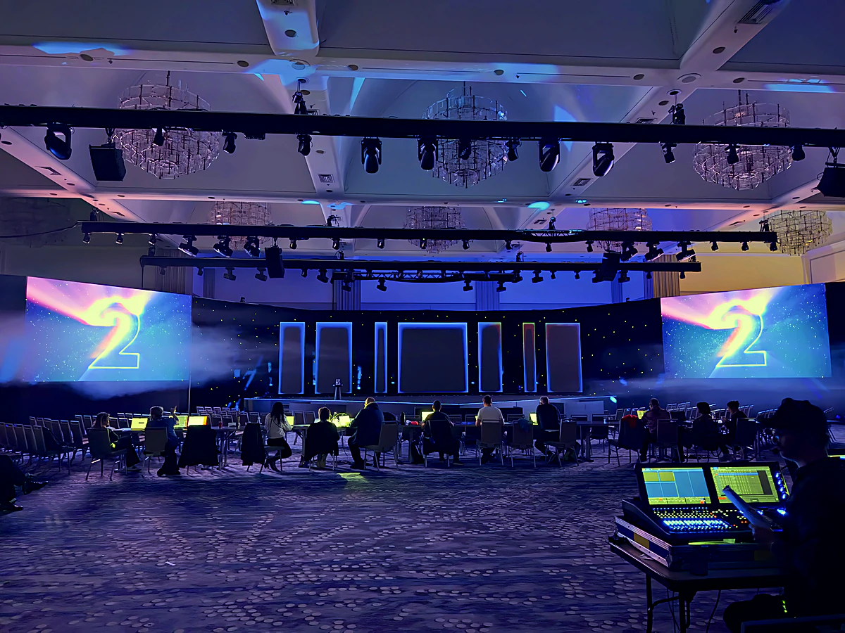 General-session stage with wraparound LED during a global sales kickoff build
