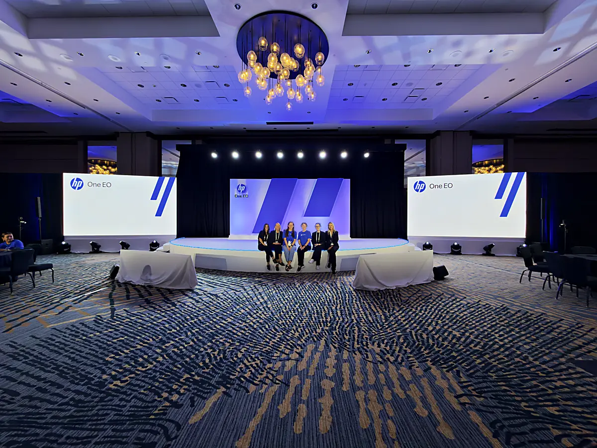 Custom half-circle stage and LED walls at a technology executive summit