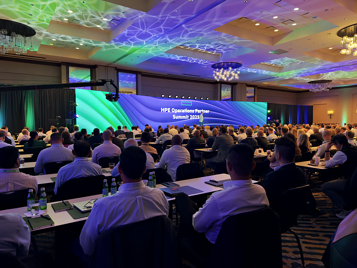 Packed HPE partner summit general session with curved LED wall and camera jib