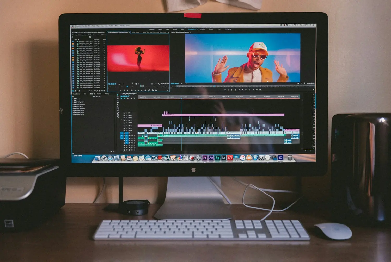 Motion designer building keynote animation on a multi-monitor workstation