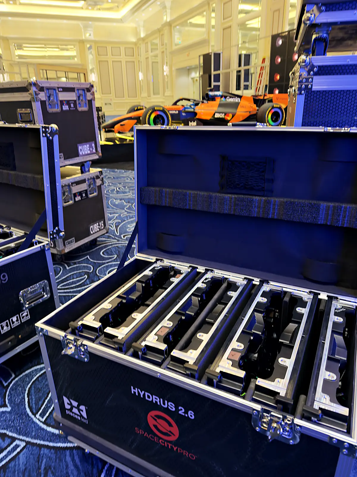 An open Space City Pro LED road case with racked panels, the show car glowing beyond